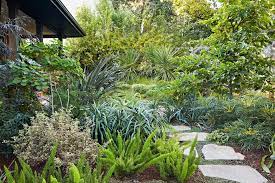 This Family S Lush Landscape Is Full Of Small Space Edible Gardening Ideas Edible Garden Small Space Gardening Garden Flagstone