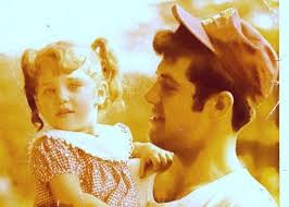 This a photo of me and my first born who died of SIDS. It is the only photo  I have of me holding her. Can someone fix this picture? My hair was