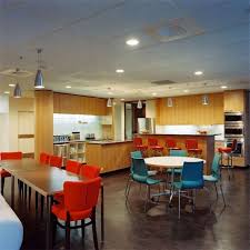 A Simple Breakroom Setup With Colorful Chairs Office Break Room Break Room Design Lunch Room