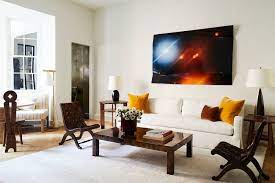 The twist pile carpet, choice of modern furniture, and the bright and bold patterns on the throw cushions, serve as nice garnishing to the overall taste of this living room design. 55 Best Living Room Decorating Ideas Designs