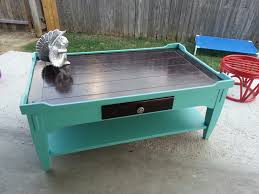 Handmade using reclaimed doors, this coffee table features turned pine legs in bold turquoise for western style. Turquoise Rustic Coffee Table Fifty Shades Of New Furniture