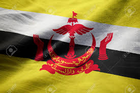 The yellow field represents the sultan of brunei.the red crest consists of a crescent facing upwards, joined with a parasol, with hands on the sides.black and white stripes run across the flag. Nahaufnahme Der Gekrauselten Brunei Flagge Brunei Flagge Die Im Wind Durchbrennt Lizenzfreie Fotos Bilder Und Stock Fotografie Image 76664530