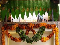 Here Is A Toran Made From Actual Mango Leaves And Marigolds For Good Fortune Diwali Decorations Wedding Backdrop Decorations Inexpensive Wedding Flowers