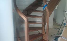 The wooden stairs match the flooring and the handrail has a very similar look. Modern Timber Staircase With Glass Railing Uk Siller Stairs