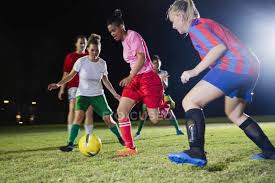 History since women's soccer debuted at the 1996 atlanta games — was announced wednesday, and it includes the three. Young Female Soccer Players Playing On Field At Night Running For Ball African Ethnicity Women Stock Photo 202761920