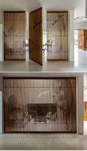 The attractive solid wood partition design is a feasible solution at wooden street which will help you in organizing your space whether it's about dividing space, hiding the clutter or. Partition Design House Around A Courtyard Charged Voids Divider Design Room Divider Design House Interior