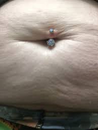 Caring for your belly button piercing. How Painful Is A Belly Button Piercing I Am Thinking Of Getting One But I M Afraid It Will Hurt And Take A Long Time To Heal Quora