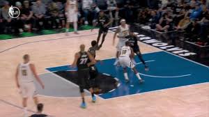 Tim Hardaway lays in a Nuggets and-1