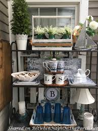 The perfect modern rustic patio combines western themed patterns and rust colors with wooden palette seating and tables, accented by steel planter buckets. Nautical Decor Tablescape For A 3 Season Porch Between Naps On The Porch