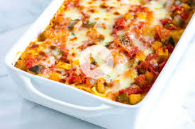 A delicious vegetarian lasagna using corn tortillas instead of lasagna noodles, layered with salsa, black beans, cheese, and guacamole. Best Vegetables Lasagna Recipe