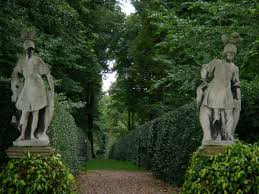 Guarding The Gate Renishaw Hall Home To The Sitwells England Gardendesign British Garden English Garden Design Garden Statues