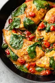 This Easy Chicken Recipe Has Burst Cherry Tomatoes Garlic Baby Spinach And A Lighter White Wine Sauc In 2020 White Wine Chicken Easy Chicken Recipes Chicken Recipes
