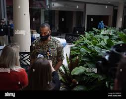 U.S. Navy Cmdr. Greg Leveque, the officer in charge of the state-run,  federally-supported COVID-19 Community Vaccination Center in Norfolk,  Virginia, speaks with local Hampton Roads media following a press  conference at the