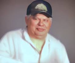 Iowa family canoeing through grass waves in Mahaska County