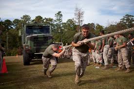 U.S. Marine Corps Gunnery Sergeant Harold Rivera, left,