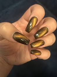 Black And Orange Cat Eye Nails Cats Eye Nails Eye Nail Art Cat Eye Nails Cat Nails