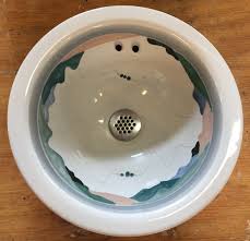 circa 1980 stoneware top mount lavatory