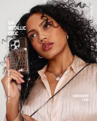 This Holiday, shine brighter with Gia. Back in a glam new metallic Pewter  shade, just in time for party szn. Explore the entire collection of glossy,  croc-embossed leather accessories, available in our