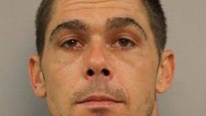 Police: Man threatens woman, child with butcher knife