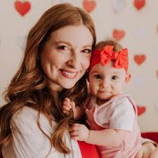 Are there any warm indoor pools in Papillion with good open swim hours?