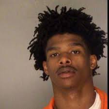 Macon man wanted for teaching children how to be in a gang still at large