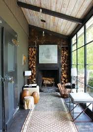 There are many types of sunroom fireplaces, so choose wisely. Great Sunroom Fireplace Porch Rustic Fireplaces Glass Garage Door Lean To