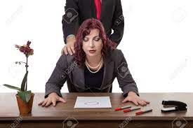 Secretary Bent Over Desk With Her Boss Standing Behind Her Stock Photo,  Picture and Royalty Free Image. Image 47466899.