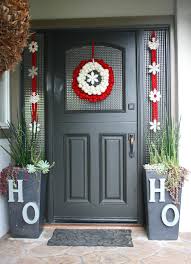 Place your faux flowers inside your container and secure a ribbon as an embellishment or hanger. 25 Beautiful Christmas Door Decorating Ideas For Your Inspiration