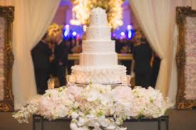 These hanging installations, which are usually prominently displayed at receptions, are a unique way to ensure every guest sees your dessert offerings. Stunning Floral Cake Tables For Your Wedding Reception