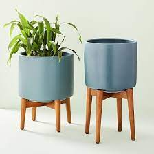 Mid century ceramic planter bowl with acacia wood stand. Turned Wood Leg Standing Planters Blue Planter Stand Wood Turning Wood Planters