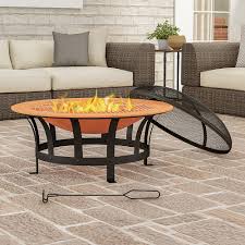A fire pit is a great way to tie your outdoor décor together. Pure Garden 30 Outdoor Deep Fire Pit Round Large Copper Colored Steel Bowl Mesh Spark Screen Log Poker Grilling Grate Copper And Black M150396 Best Buy