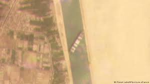 Shows the cargo ship mv ever given stuck in the suez a cargo container ship that's among the largest in the world has turned sideways and blocked all traffic. O3fenjshyoopwm
