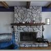 White paint gives this brick fireplace a charming, timeworn look. 1