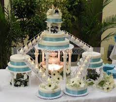 This Is My Favorite I Love The Layers I M Not So Sure About The Candles On The Stairs I Kinda Want The Brides Fountain Wedding Cakes Fountain Cake Cake Boss