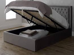 New modern navy blue wooden ottoman storage bed frame 4ft 4ft6 5ft. 5ft King Size Raya Silver Grey Fabric Upsholstered Ottoman Lift Up Storage Bed Frame London Bed Centre