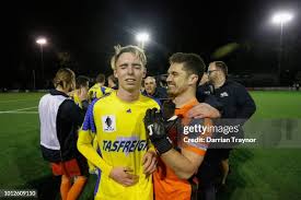 Adrian Mancini of Northcote City pushes Brayden Mann of the Stikers... News  Photo