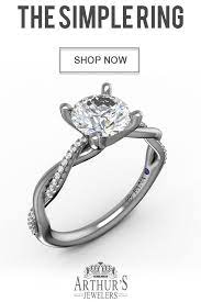 The Simple Engagement Ring Featuring A Twist Of Diamonds Available Unique Diamond Engagement Rings Fancy Yellow Engagement Ring Round Diamond Engagement Rings