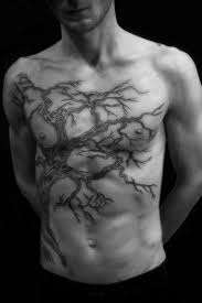 Tattoos In Modern Writing What They Say About Characters Tree Tattoo Men Tree Tattoo Chest Chest Tattoo Men