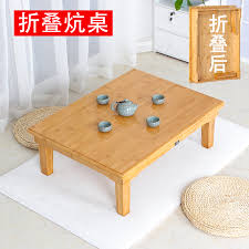 A glass coffee table makes for an elegant, subtle addition to the room, while a coffee table with storage is perfect for creating space for a striking centerpiece. Bamboo Folding Kang Table Tatami Table Bay Window Dining Table Square Solid Wood Square Table Small Coffee Table Low Table Kang Table