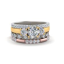 Perhaps the most common way to wear them, this tradition stems all the way back to an idea from the ancient egyptians, who believed we had a vein leading directly from the left ring finger to the heart. 3 Stone Engagement Ring With Stacking Band In 14k Rose Gold Fascinating Diamonds