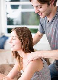 Couple lying on massage desks. Great Date Night Idea Couples Massage Class Datenight Love Couples Massage Gift Anniversary Date Night Unique Date Ideas Massage Classes