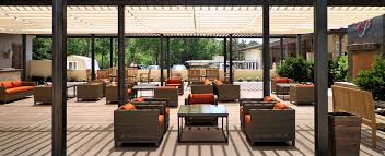 This meant the patio cover could start at the edge of the house's roof at a height of eight feet and slope down to seven feet, leaving a clearance of more than six and a half feet between the lowest part of the frame's headers and the ground at its outer edge. How Much Do Patio Covers Cost Superior Awning