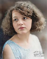 This W. J. Ramsey portrait shows a young woman in a beaded dress. Taken by  photographer W. J. Ramsey in Gainesville, Georgia, around the 1920s.