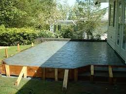 Raised Concrete Patio With Random Stone Pattern Work Done In British Columbia Concrete Patio Patio Design Patio Steps