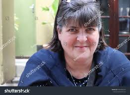 Mature Woman Looking Into Camera Naughty Stock Photo 1872865576