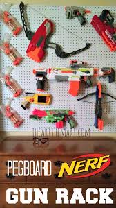 I thought about a pegboard system like this one, . Nerf Gun Rack Nerf Elite Blaster Gun Rack Organizer Plus Shelving And