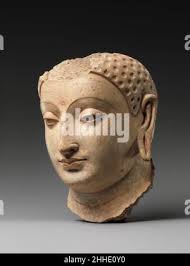 Head of a Buddha, Gupta period, 5th century, India, Stone, H. 6 7/8 in.  (17.5 cm); W. 4 in. (10.2 cm); D. 5 1/8 in. (13 cm Stock Photo