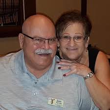 Who is the priest that attended the Northeast High School Class of 1969  reunion?