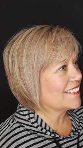 Scissorless, clipper cut stacked bob asymmetrical...cut/color by Tina  Strasser