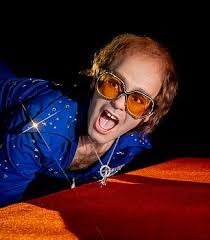 Elton John's new wax figure is Madame Tussauds' 'most ambitious ever' as  the iconic singer defies gravity over his rhinestone piano